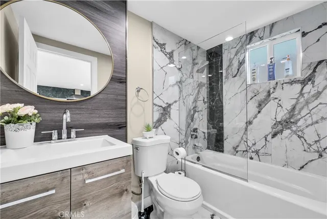 a kitchen with a refrigerator sink and cabinets