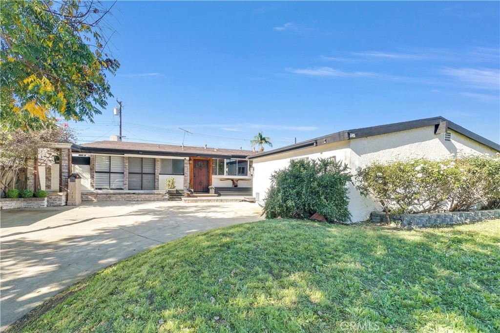 645 South Trident Street Anaheim, CA 92804 - Photo 30 of 30 a view of a house with backyard and porch