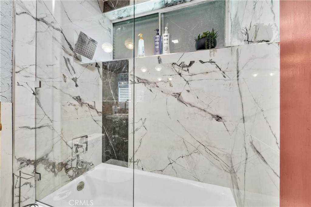 645 South Trident Street Anaheim, CA 92804 - Photo 9 of 30 a bathroom with a bathtub and shower