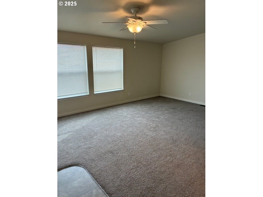 3108 Southwest River View Drive Pendleton, OR 97801 - Photo 18 of 37 a view of a livingroom with a ceiling fan and window