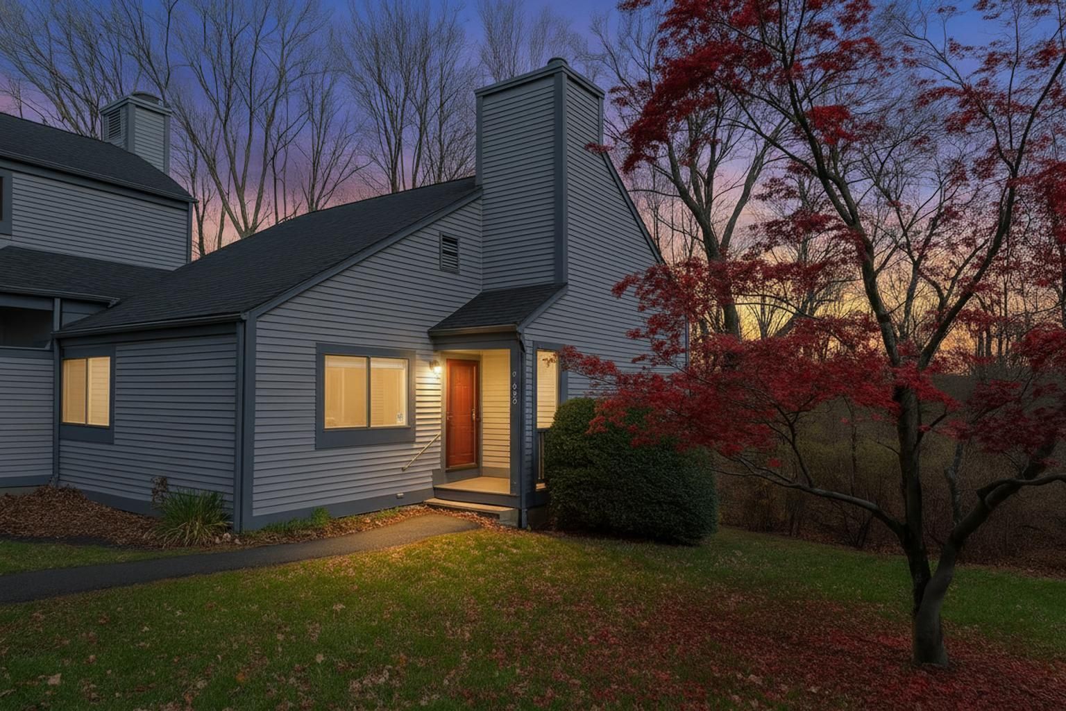 a view of a house with a yard