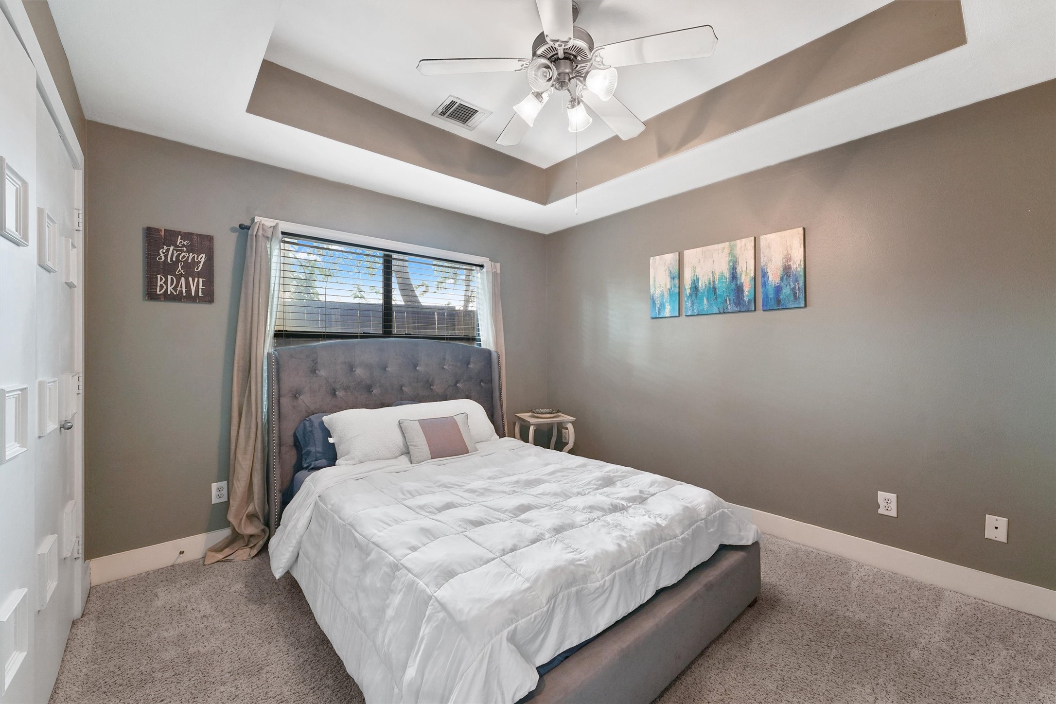 3405 Rolgom Pl Court Houston, TX 77021 - Photo 4 of 11 a bedroom with a bed and a chandelier