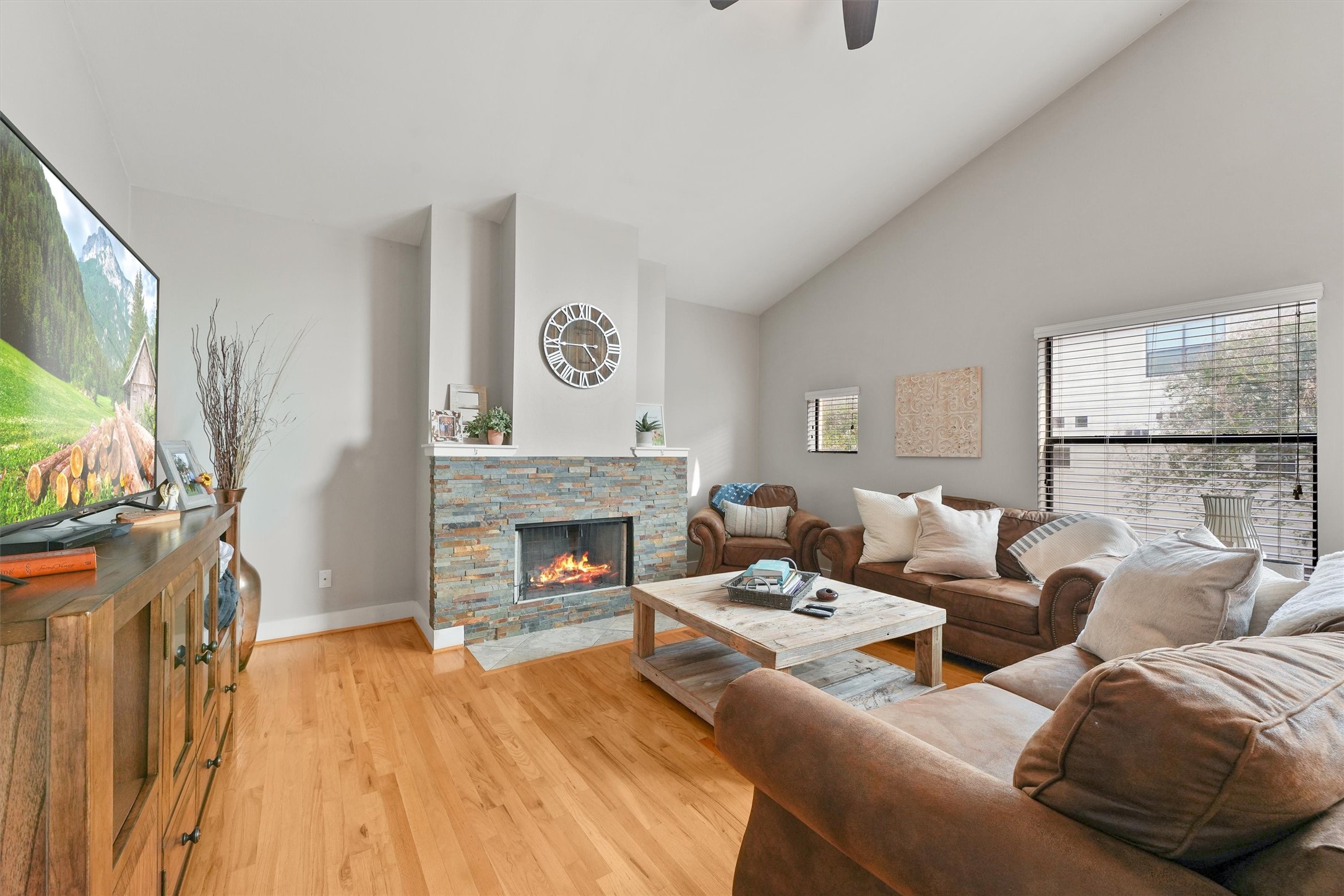 3405 Rolgom Pl Court Houston, TX 77021 - Photo 7 of 11 a living room with furniture a flat screen tv and a fireplace