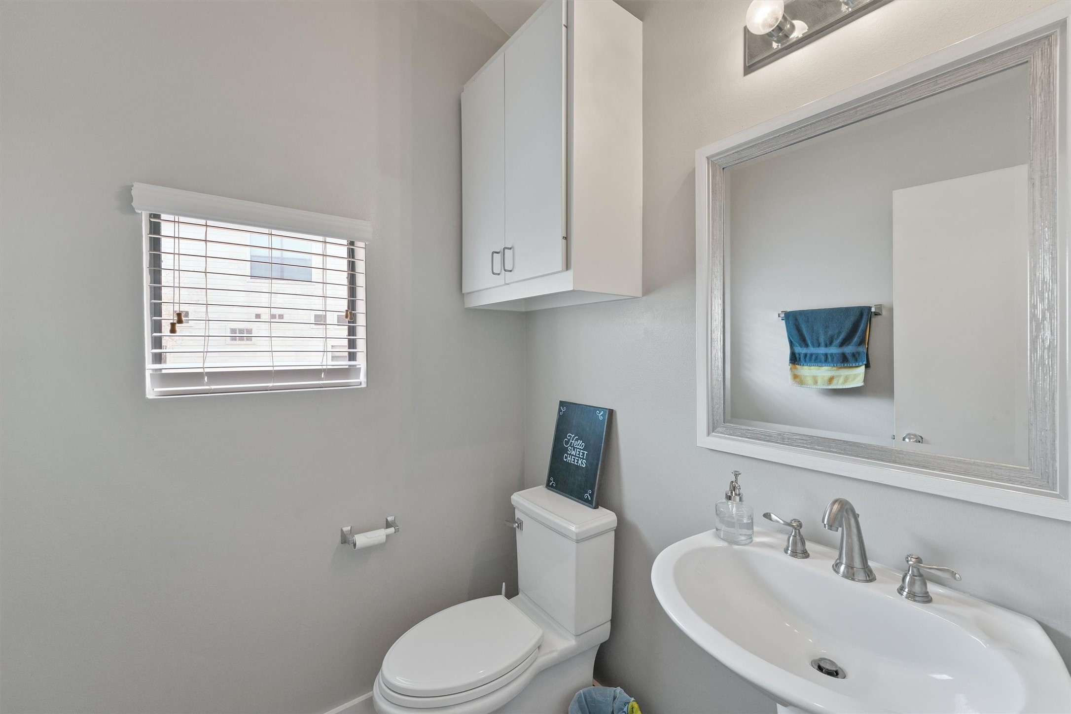 3405 Rolgom Pl Court Houston, TX 77021 - Photo 8 of 11 a bathroom with a sink a mirror and a toilet