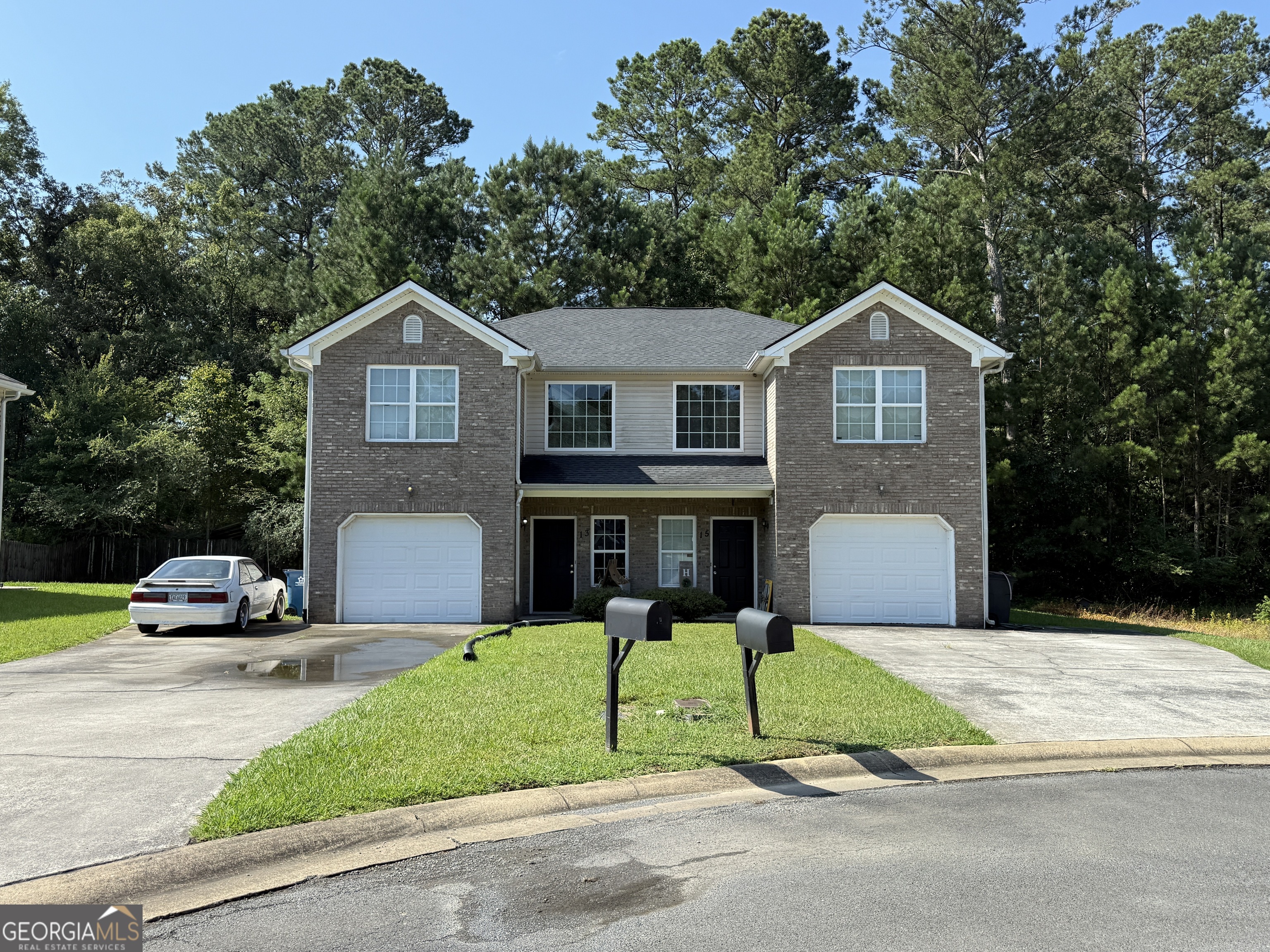 13 Crabapple Lane Northwest Rome, GA 30165 - Photo 1 of 3 a front view of a house with a yard and garage