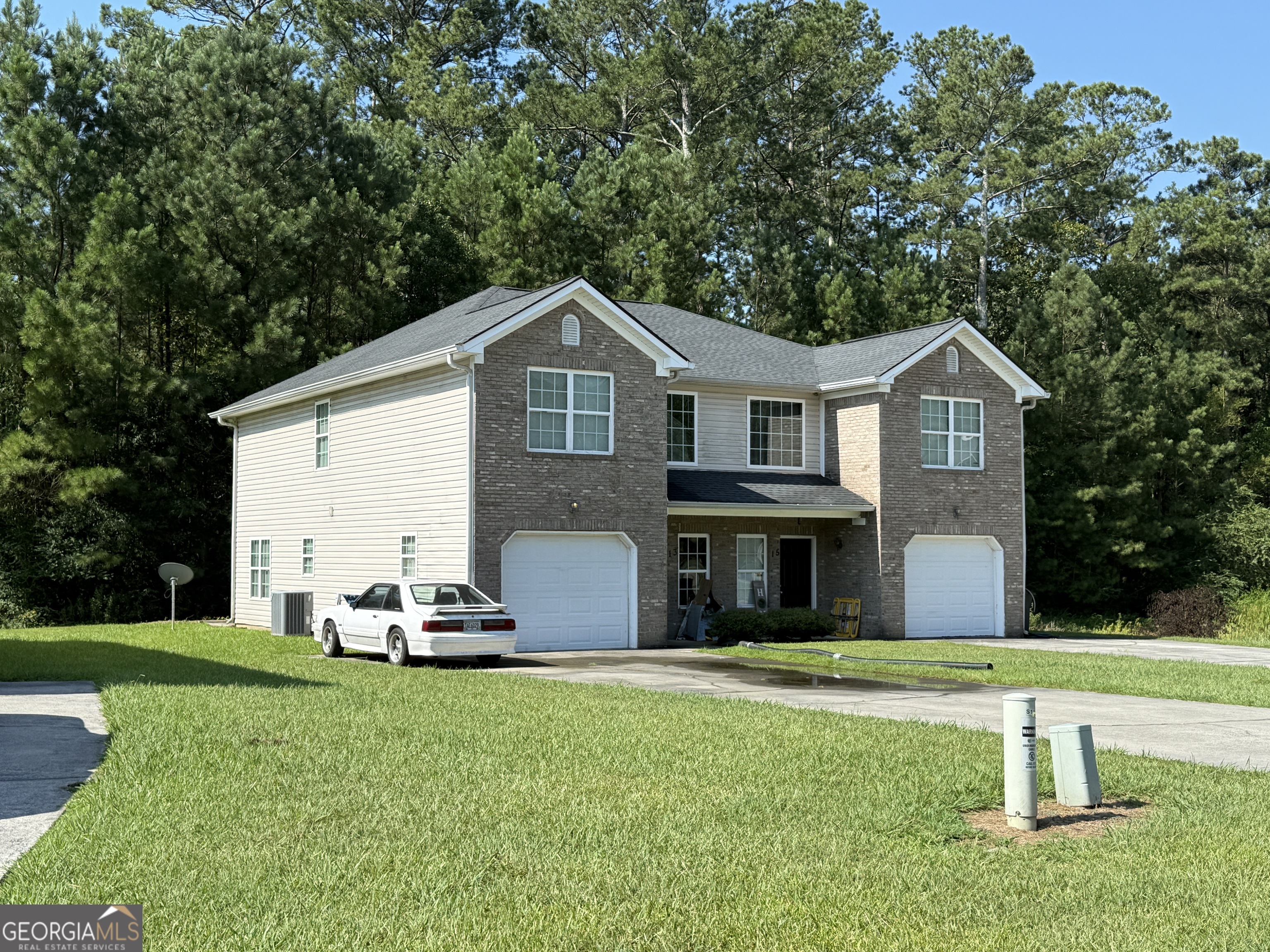 13 Crabapple Lane Northwest Rome, GA 30165 - Photo 2 of 3 a front view of a house with a garden