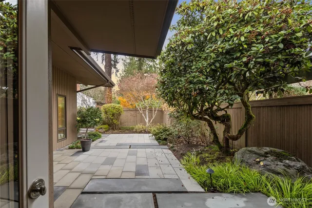 a spacious bedroom with a large bed and a large window