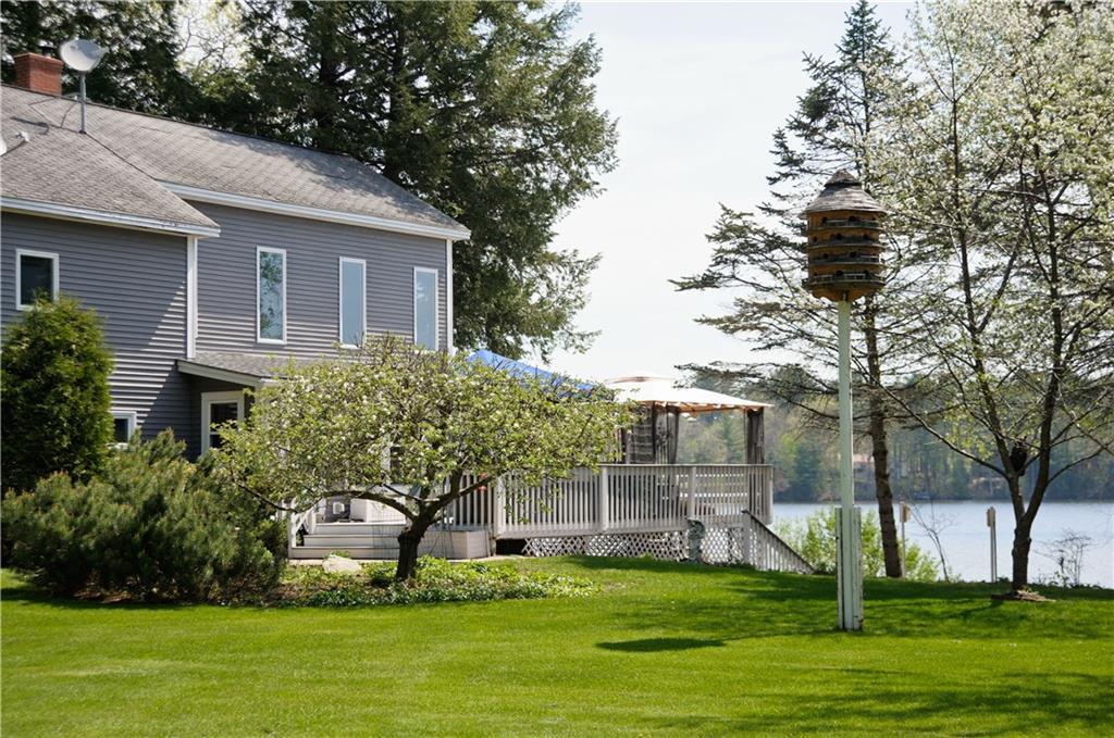 78 Pine Point Road Oxford, ME 04270 - Photo 4 of 35 Side lawn looking at deck.