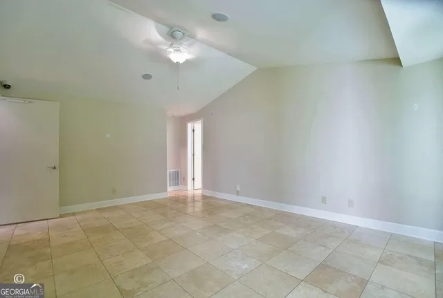 a kitchen with stainless steel appliances granite countertop a sink and a stove next to a window