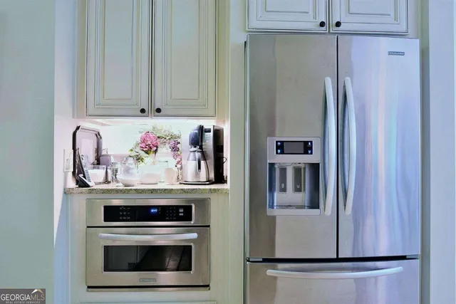 a kitchen with stainless steel appliances granite countertop a stove and a sink