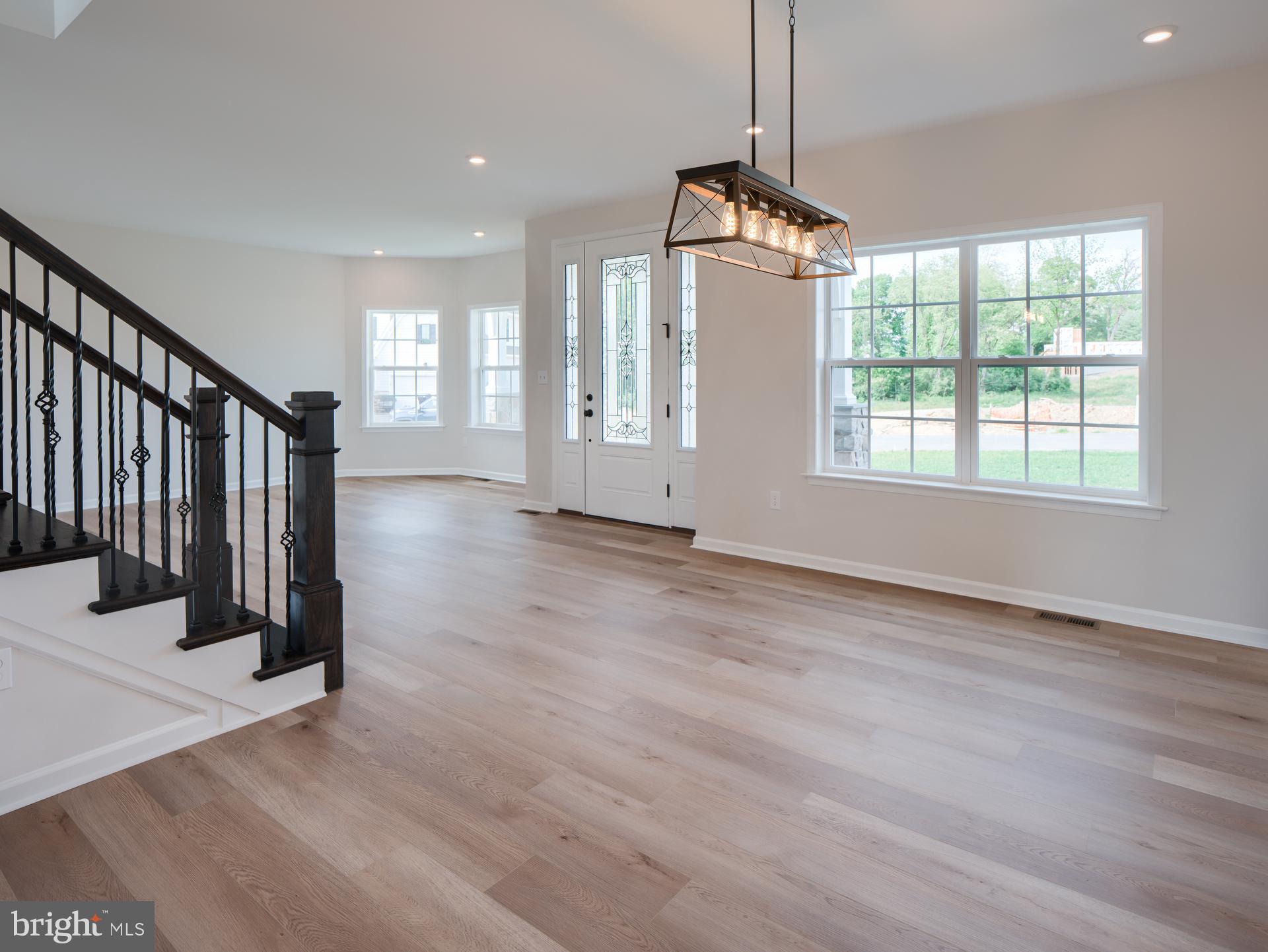 232 West Side Drive Lititz, PA 17543 - Photo 12 of 27 an empty room with wooden floor and windows