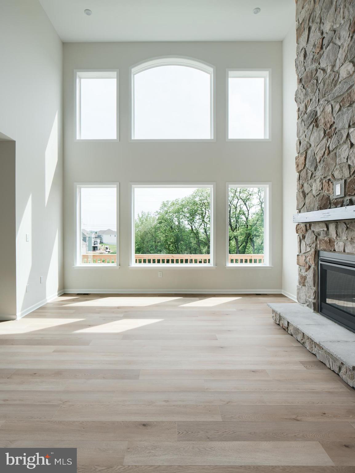 232 West Side Drive Lititz, PA 17543 - Photo 13 of 27 a view of an empty room with a window and a fireplace