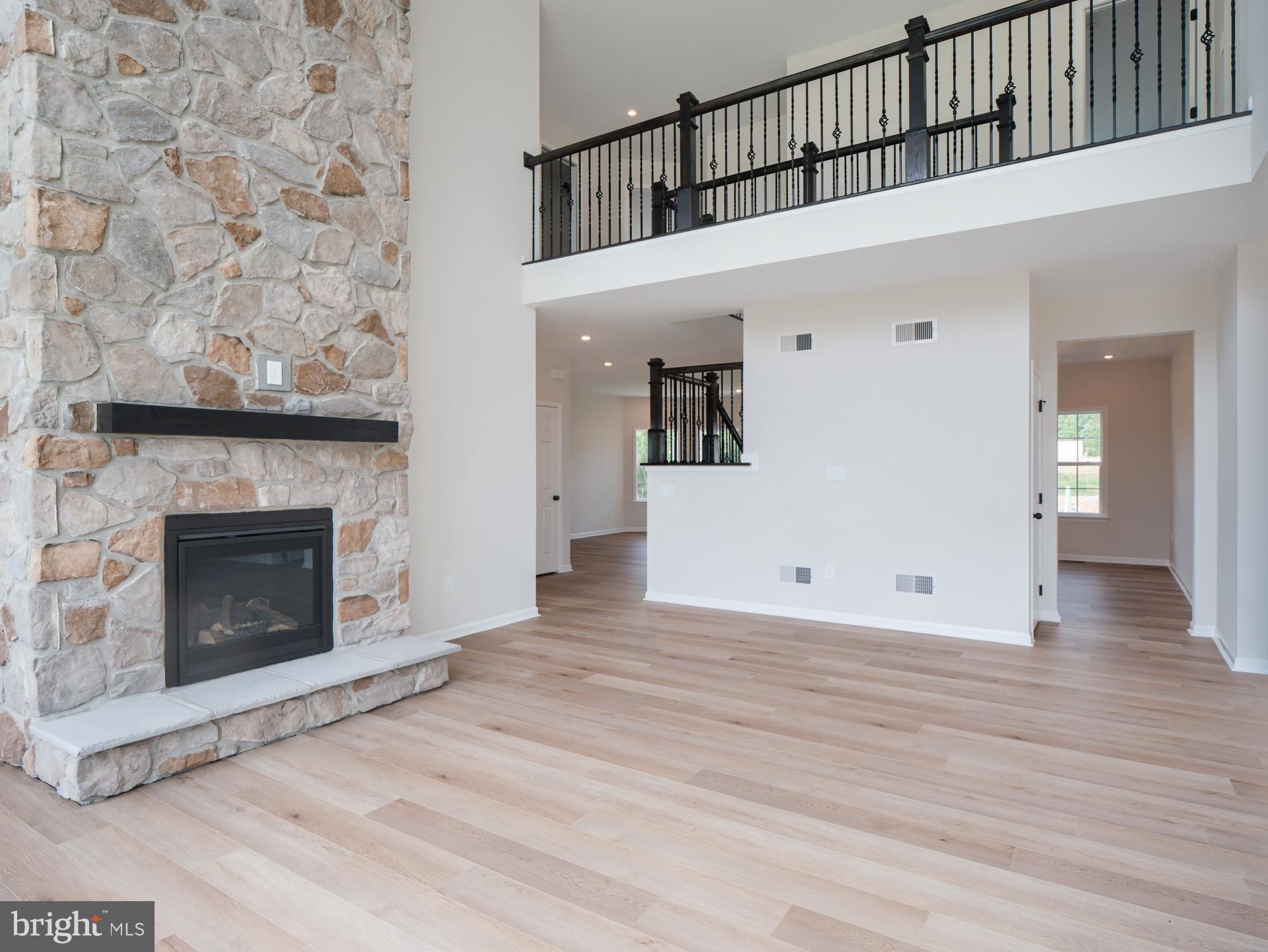232 West Side Drive Lititz, PA 17543 - Photo 16 of 27 a view of a livingroom with wooden floor and a fireplace