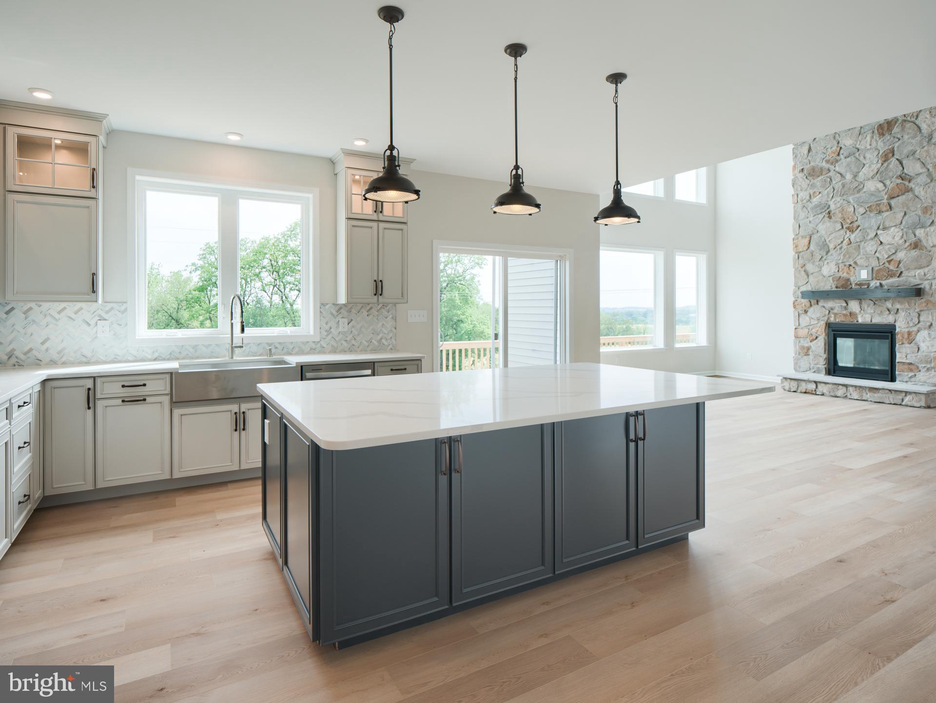 232 West Side Drive Lititz, PA 17543 - Photo 20 of 27 a kitchen with stainless steel appliances granite countertop a sink a stove a refrigerator and a window