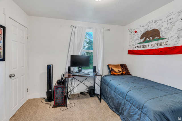 358 400 South Provo, UT 84601 - Photo 25 of 34 Carpeted bedroom featuring a desk and baseboards.