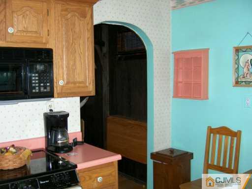 43 Markham Road Edison, NJ 08817 - Photo 3 of 4 a kitchen with a sink and a stove top oven