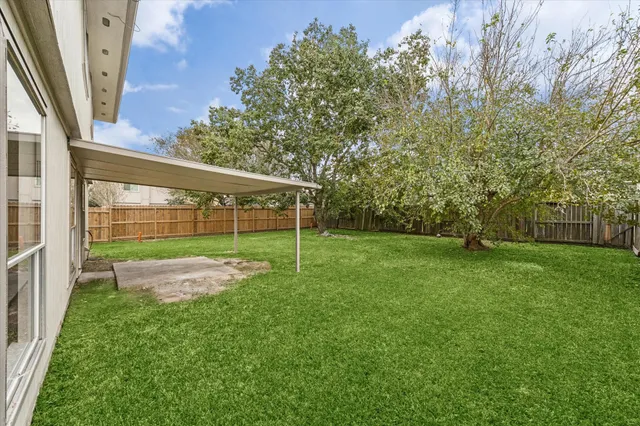 a view of a backyard with a garden