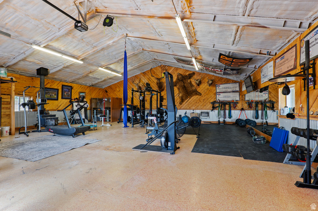 115 East 1600th Street North Santaquin, UT 84655 - Photo 36 of 52 Spacious multi-purpose room featuring wood-paneled walls and a vaulted ceiling