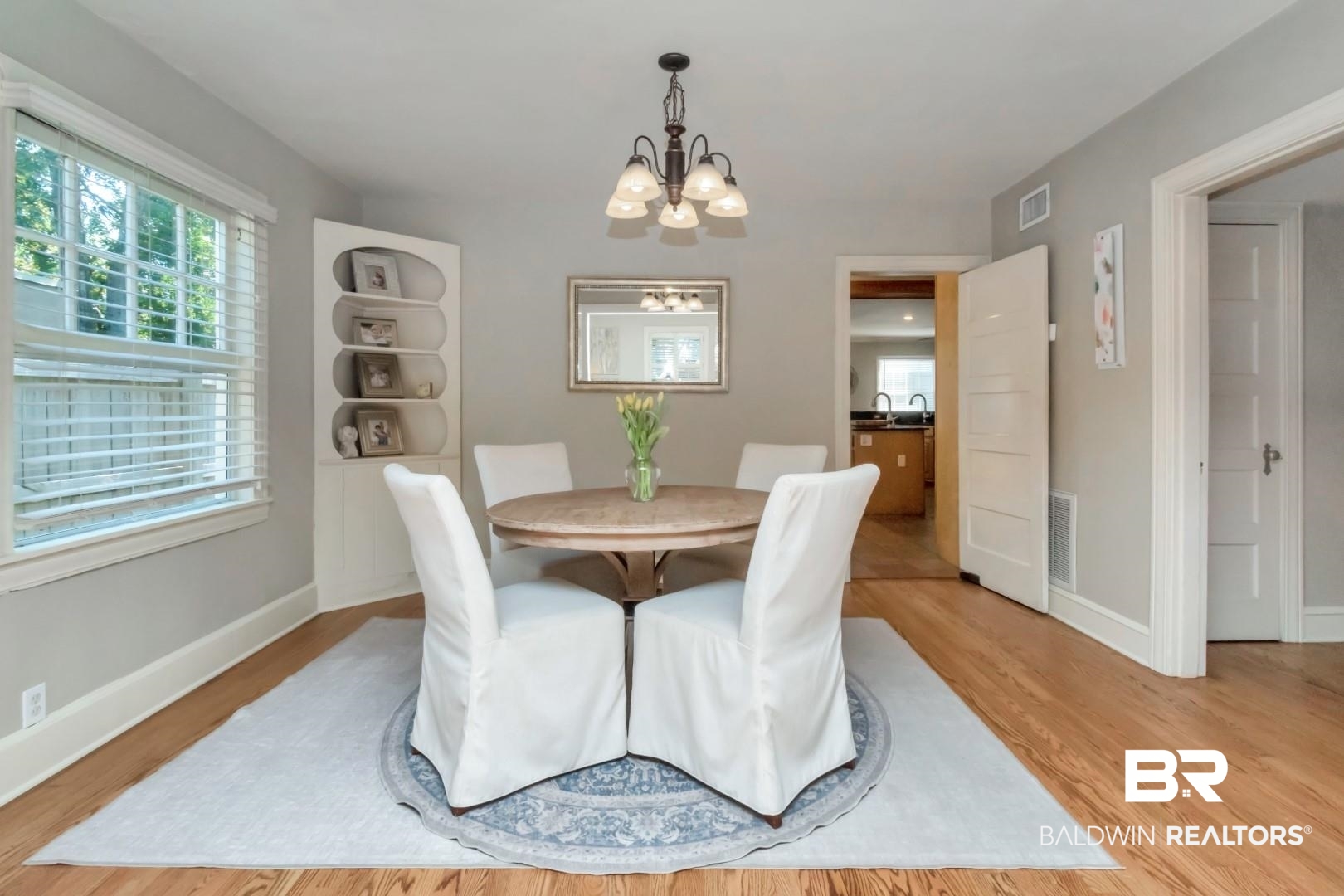 116 Florence Place Mobile, AL 36607 - Photo 9 of 41 Dining room featuring light wood-type flooring and a chandelier