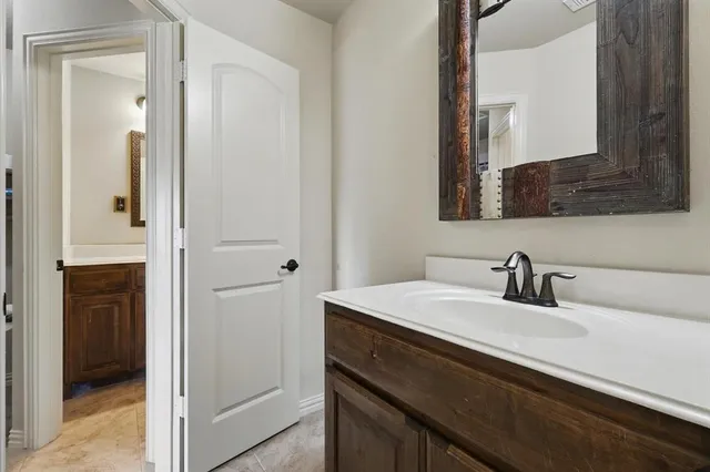 a bathroom with a sink and a mirror