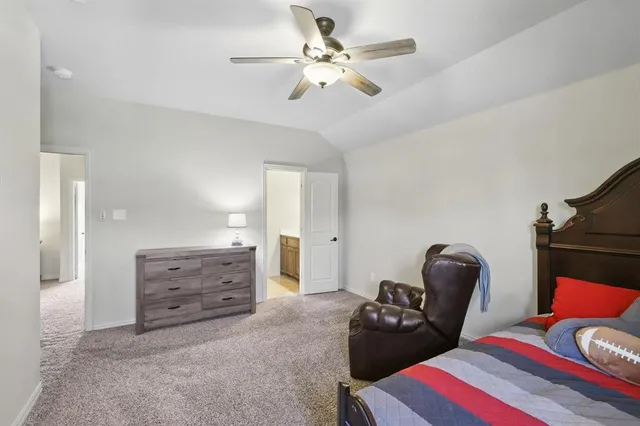 a bedroom with furniture and a closet