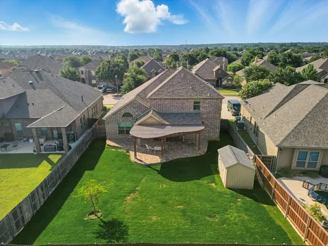 an aerial view of a house with a garden
