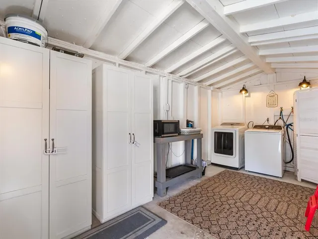 a view of a house with backyard sitting area and garden