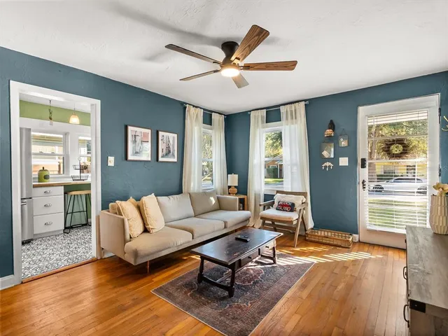 a living room with furniture and a large window