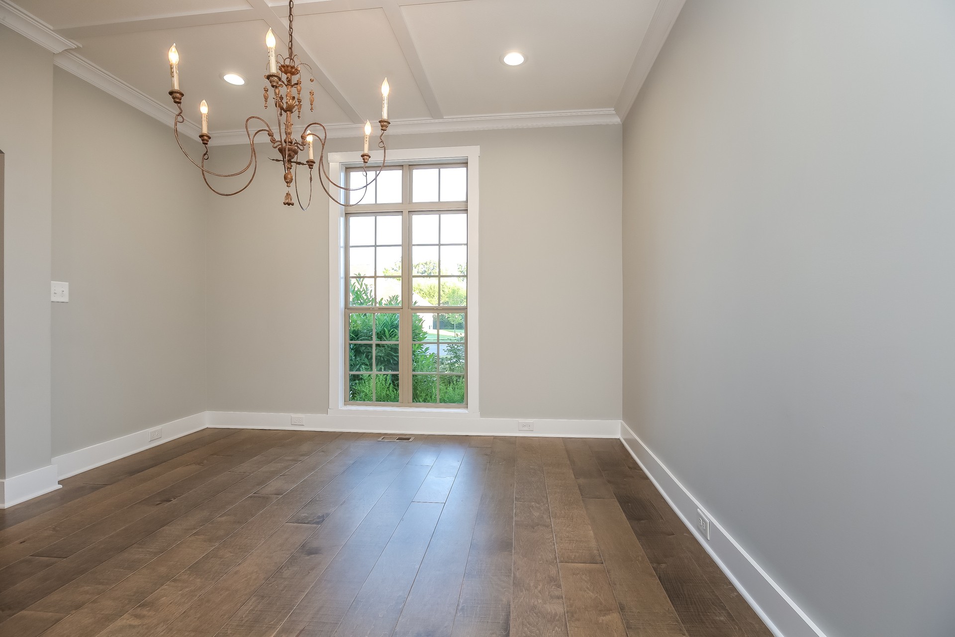 259 Harrowgate Drive Clarksville, TN 37043 - Photo 11 of 27 an empty room with wooden floor and windows