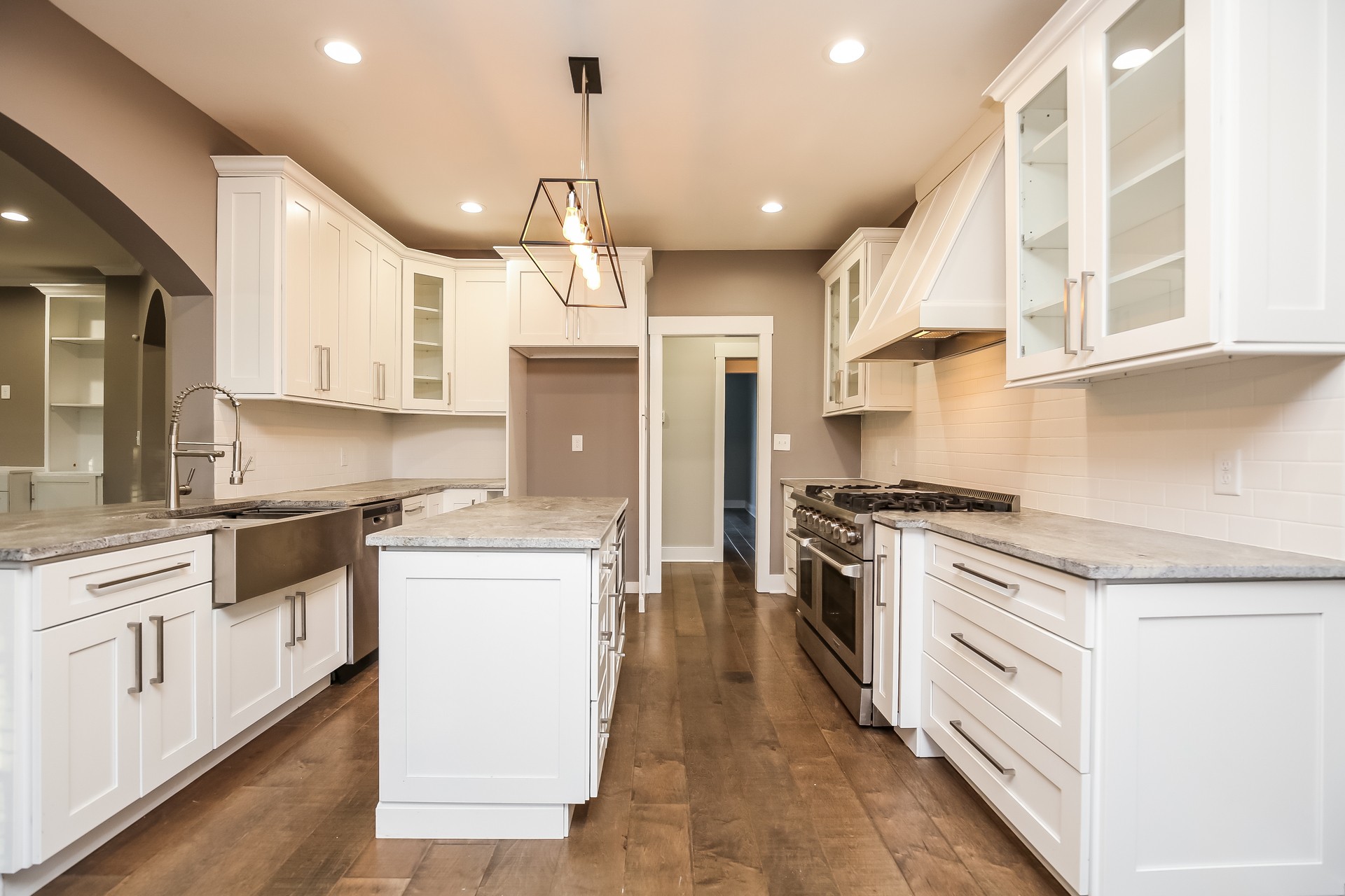 259 Harrowgate Drive Clarksville, TN 37043 - Photo 4 of 27 a large kitchen with stainless steel appliances granite countertop a stove and a sink