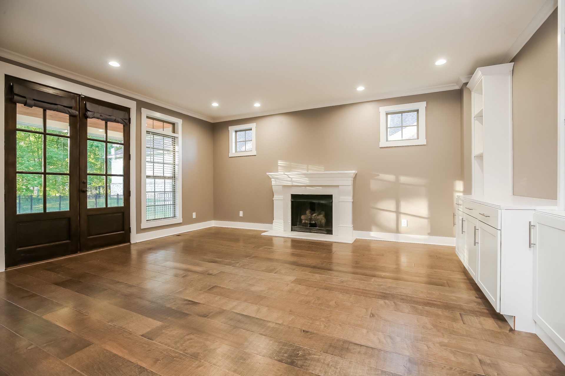 259 Harrowgate Drive Clarksville, TN 37043 - Photo 5 of 27 a view of an empty room with a fireplace and a window