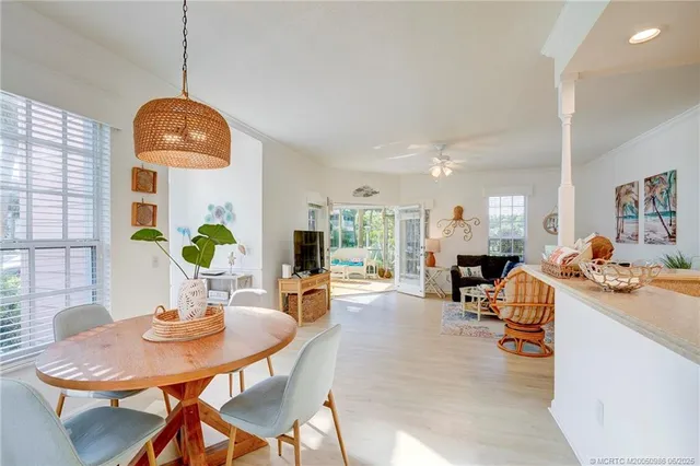 a view of a dining room with furniture and a table