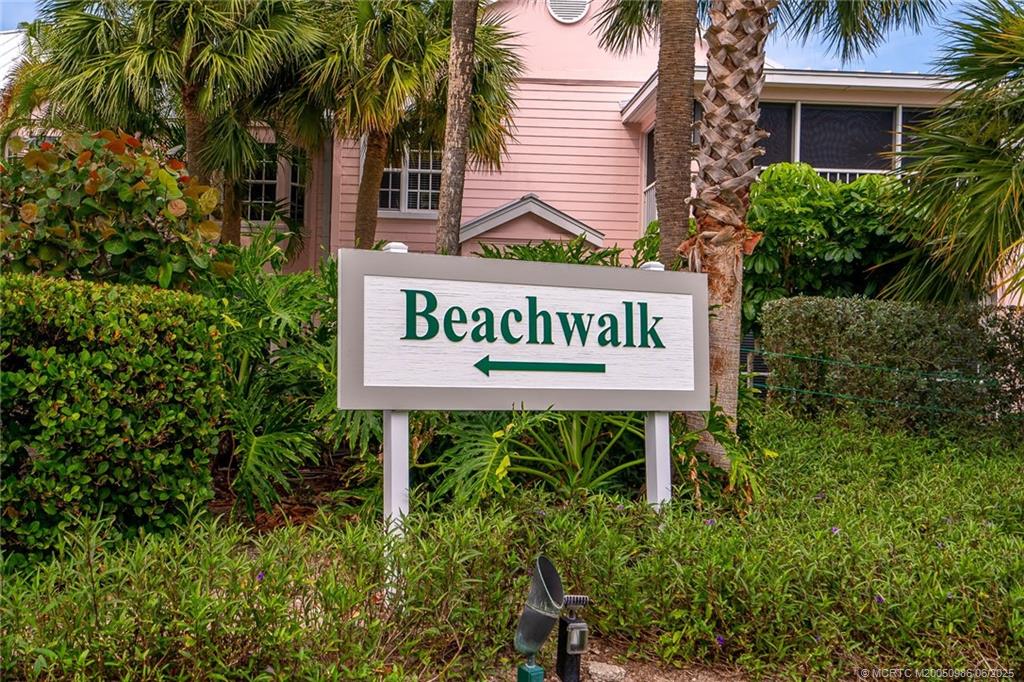 411 Northeast Plantation Road, Unit 511 Stuart, FL 34996 - Photo 2 of 45 a sign on the side of a building