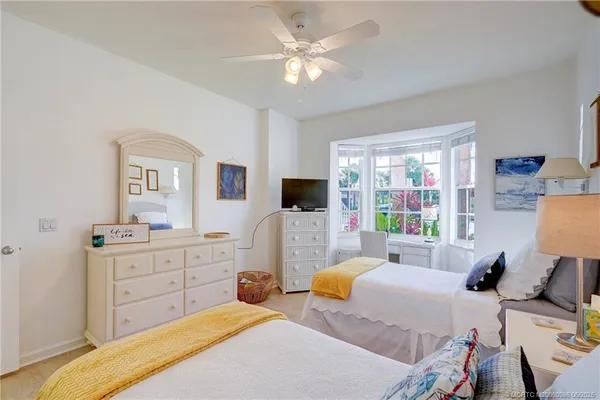 a bed room with a bed and a television