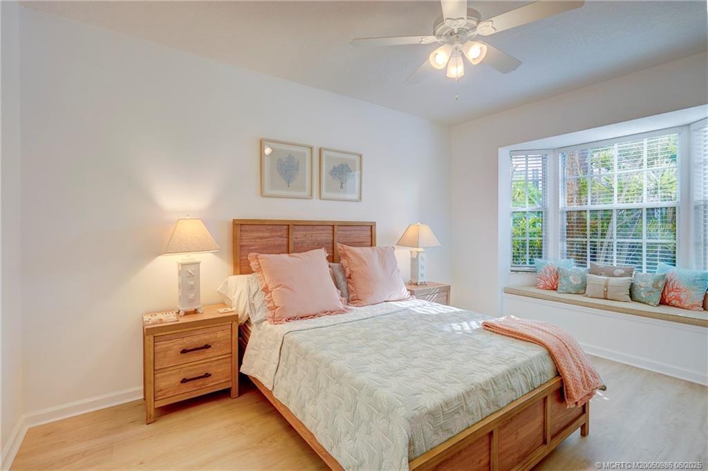 411 Northeast Plantation Road, Unit 511 Stuart, FL 34996 - Photo 31 of 45 a bedroom with a bed and a window