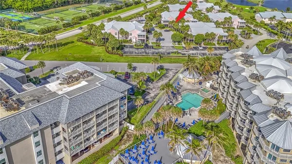 an aerial view of a houses with yard