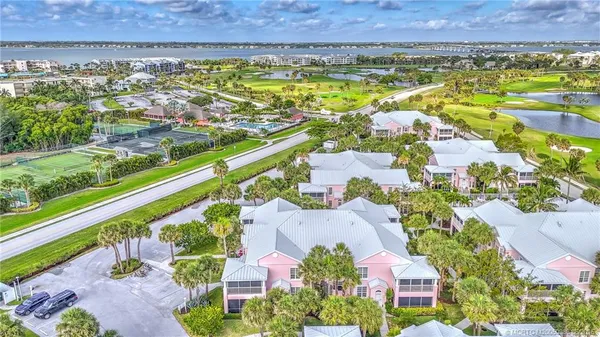 an aerial view of residential building and lake