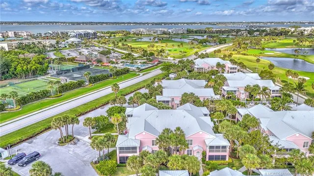 an aerial view of residential building and lake