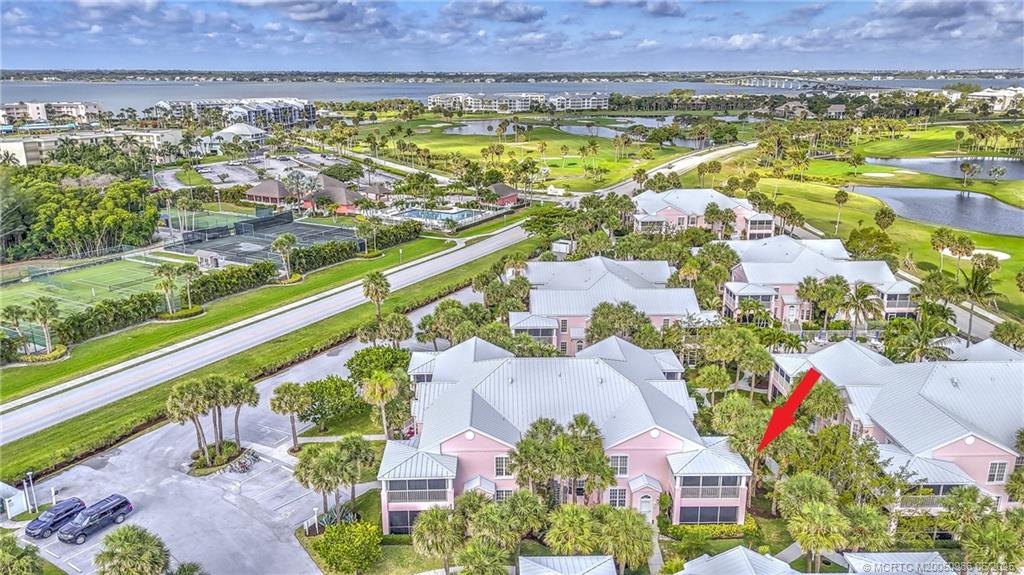 411 Northeast Plantation Road, Unit 511 Stuart, FL 34996 - Photo 45 of 45 an aerial view of residential building and lake