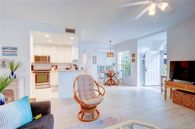a view of a livingroom with furniture and a flat screen tv