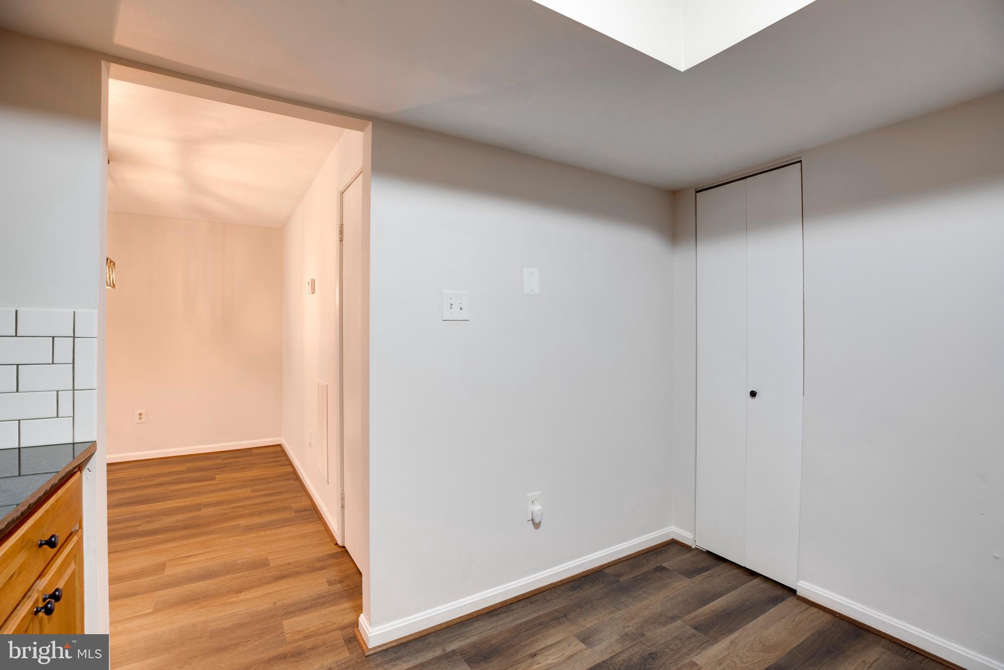 6421 Birch Leaf Court, Unit 36A Burke, VA 22015 - Photo 14 of 26 a view of a room with wooden floor