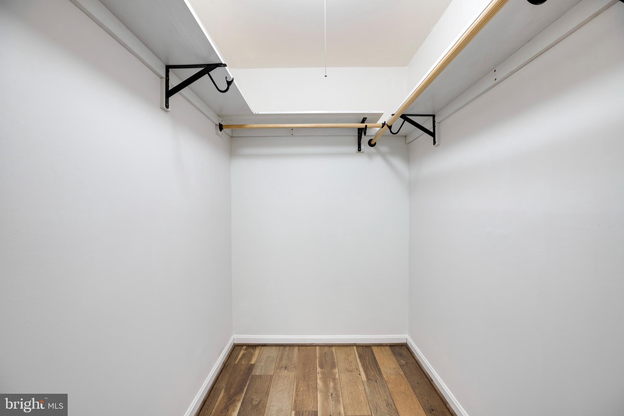 6421 Birch Leaf Court, Unit 36A Burke, VA 22015 - Photo 17 of 26 a view of a room with racks on the wall