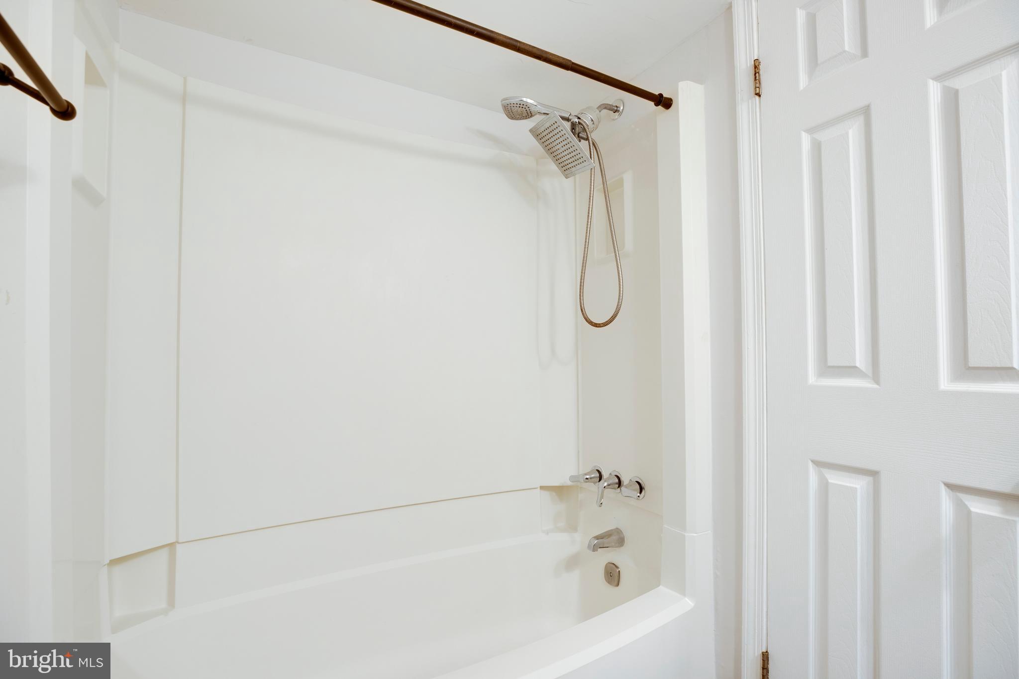 6421 Birch Leaf Court, Unit 36A Burke, VA 22015 - Photo 23 of 26 a bathroom with a shower and a bath tub