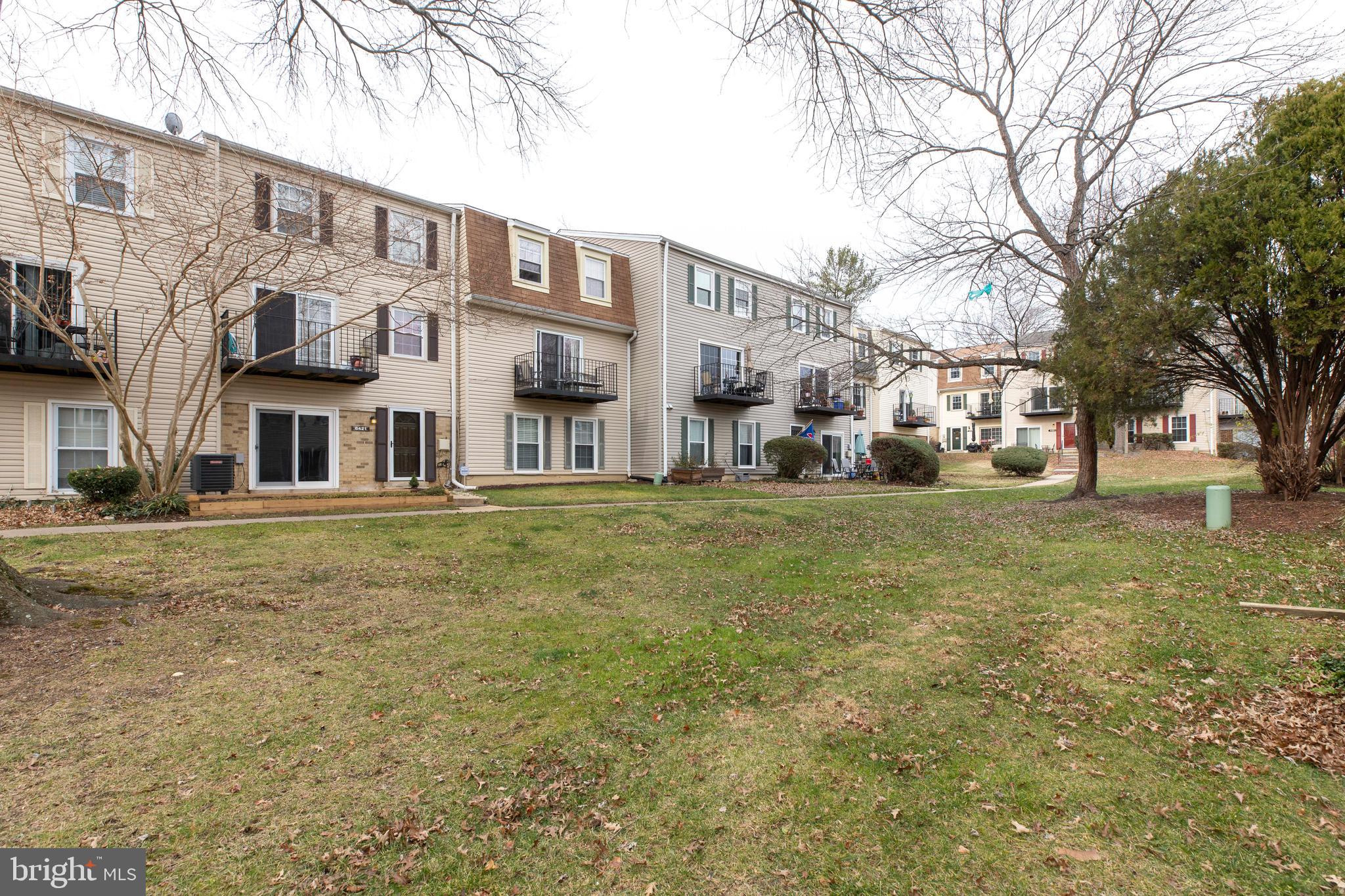 6421 Birch Leaf Court, Unit 36A Burke, VA 22015 - Photo 25 of 26 a view of a building with a yard