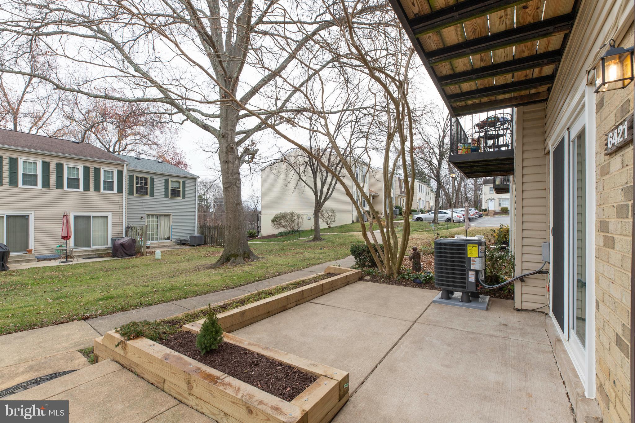 6421 Birch Leaf Court, Unit 36A Burke, VA 22015 - Photo 3 of 26 a view of a house with backyard and sitting area