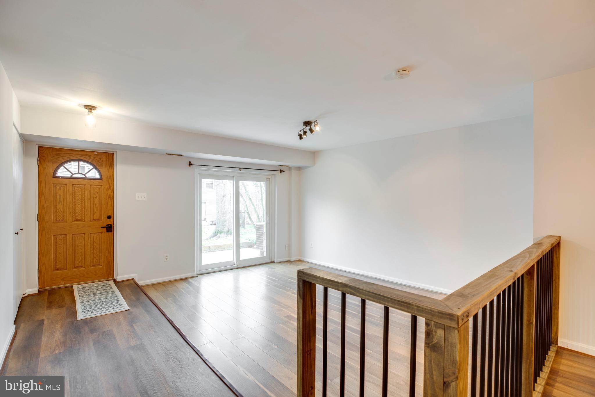 6421 Birch Leaf Court, Unit 36A Burke, VA 22015 - Photo 6 of 26 a view of hallway with wooden floor