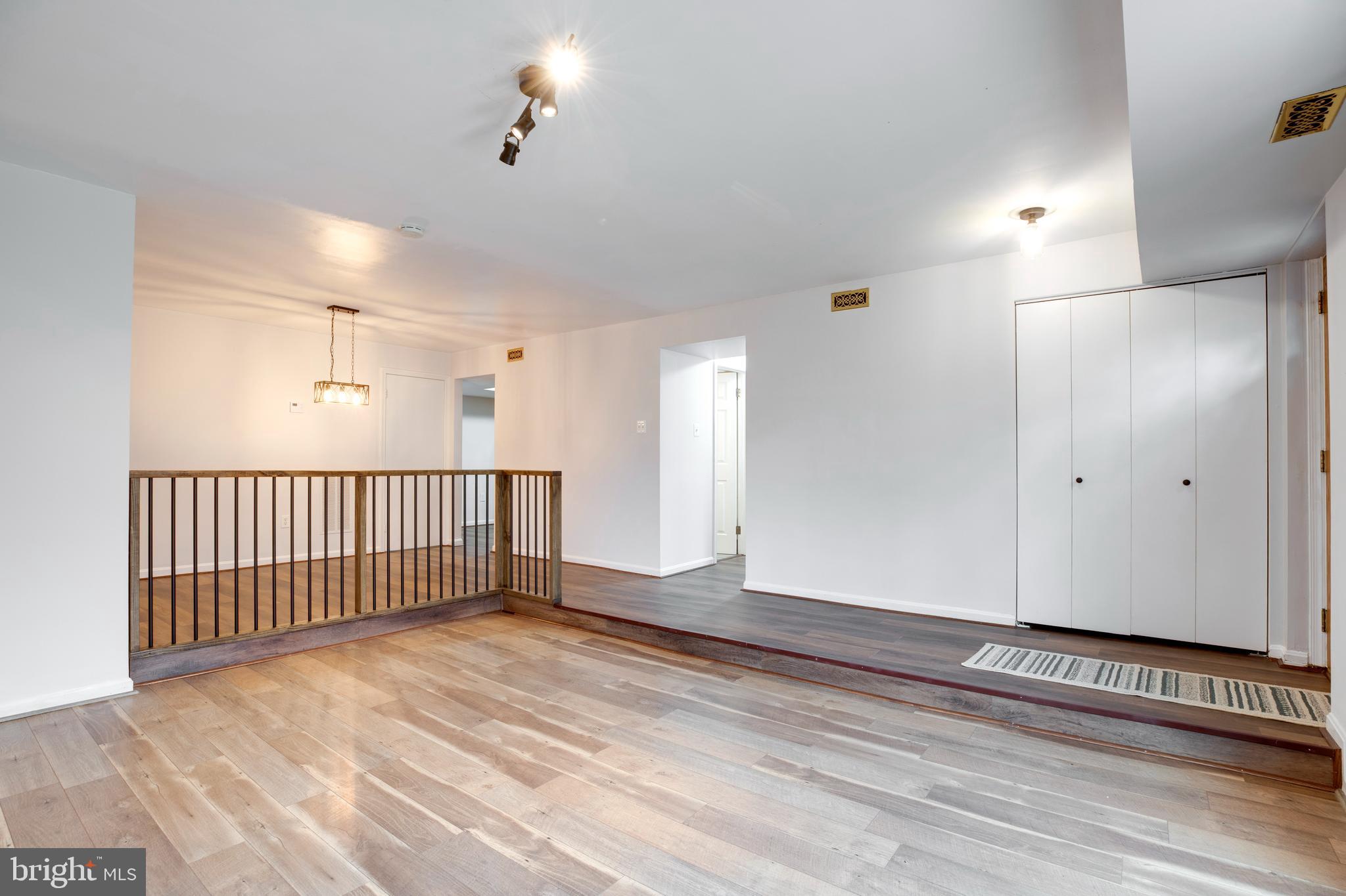 6421 Birch Leaf Court, Unit 36A Burke, VA 22015 - Photo 8 of 26 a view of a hallway with wooden floor