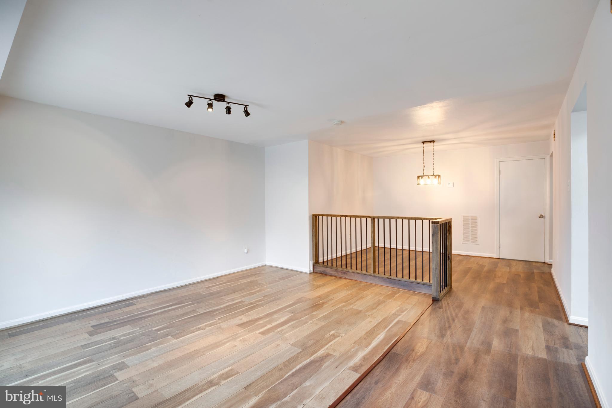 6421 Birch Leaf Court, Unit 36A Burke, VA 22015 - Photo 10 of 26 a view of a room with wooden floor