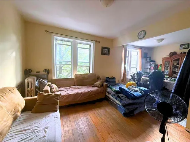 a bedroom with furniture and a window