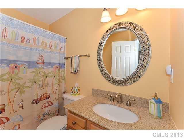 15363 Michael Andrew Road Huntersville, NC 28078 - Photo 12 of 16 a bathroom with a sink and a mirror